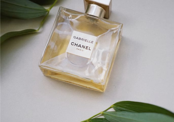 a bottle of chanel perfume laying on a table